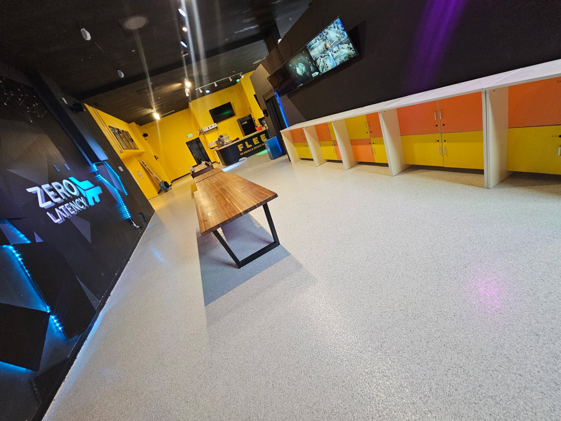 Light flake epoxy floor in the lobby of a VR arena